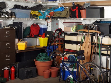 Professional team assessing garage clutter